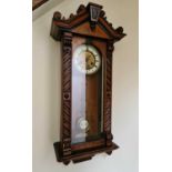 A 19th century mahogany cased Vienna wall clock, with Roman numeral dial.