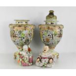 A group of Oriental ceramics comprising a pair of 20th century Japanese satsuma vases with covers,