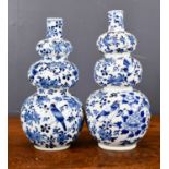 A pair of Chinese blue and white gourd vases, decorated with birds and flowers, with four