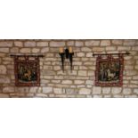 A pair of medieval style tapestry wall hanging panels, depicting lion and unicorn, hung on iron