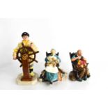 Three Royal Doulton figurines, comprising The Helmsman, HN2499, Nanny, HN2221, and The Toymaker,