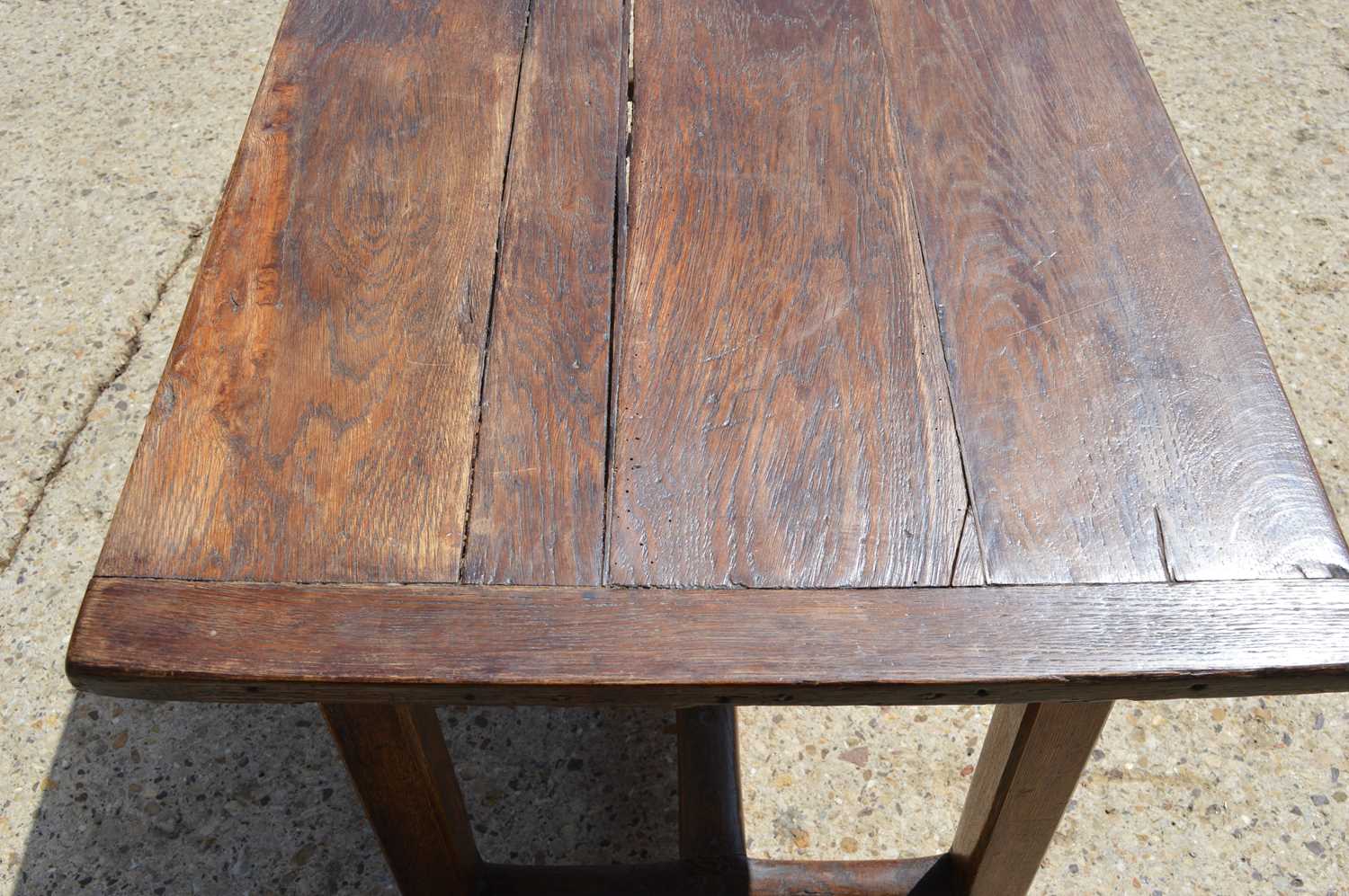 A late 18th century oak refectory table. - Image 4 of 4
