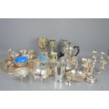 A quantity of silver plated items to include candelabras, tray, tankards and other items.