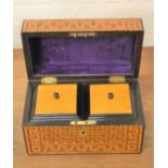 A 19th century padauk wood tea caddy, with satinwood lids, with key.