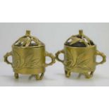 A pair of 19th century Chinese bronze twin handled censers and covers, square seal mark to the base,