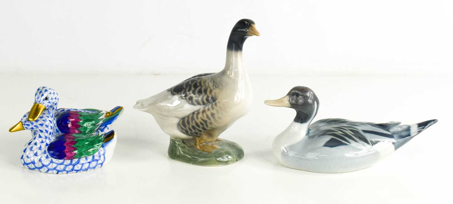 A Royal Copenhagen goose, numbered 1088 and a duck numbered 1933, together with a Herend of