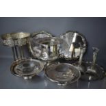 A group of silver plateware, to include wine trays, a pair of Corinthian column candlesticks, urn,