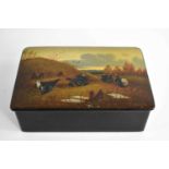 An antique black lacquered box, the lid painted with fighting hens, signed, 13cm long.