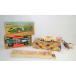 A Lincoln International "Lotus" remote controlled car in the original box together with Triang