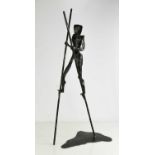 Paul Margetts, 20th century, a bronzed steel sculpture of a man using stilts.