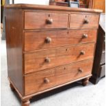 A 19th century mahogany chest of two short and three long graduated drawers, turned handles on peg