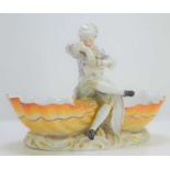 A Meissen porcelain table salt, with a man in a nightcap seated eating from a bowl, flanked by a