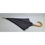 An early 20th century Paragon Fox Frames umbrella, with a 12ct rolled gold collar, black canopy with