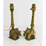 A pair of brass Indonesian elephant form lamp bases, 29cm high.