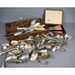 A quantity of silver plated flatware, a boxed set of vintage butter knives, and an antique cutlery