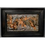 An embossed metalware plaque depicting various cherubs, with copper and bronzed finish.
