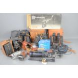 A group of vintage cameras and binoculars to include Agfa, Zeiss Ikon folding camera, Soligor