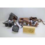 A group of vintage cameras and a radio to include King Regula, Praktica, Comet and others.