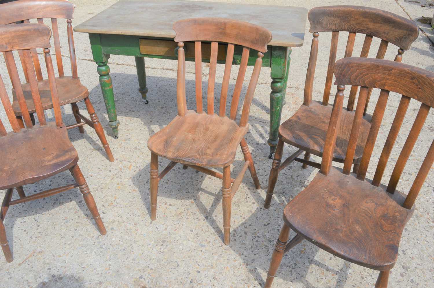A Victorian pine kitchen table with single drawer and five kitchen chairs.