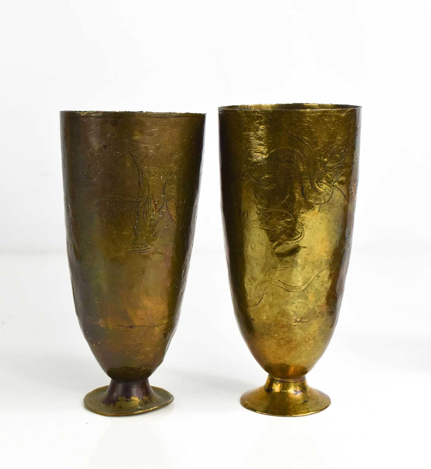 A pair of 19th century Chinese brass goblets engraved with writhen dragon decoration.