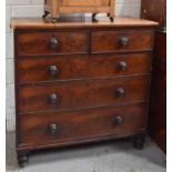 A Victorian mahogany chest of two short and three long graduated drawers raised on turned legs,