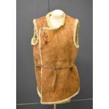 An early 20th century sheepskin jerkin, possibly military WWI era.