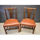 A pair of early 19th century mahogany dining chairs, scroll top rails, pierced vase shaped splat and