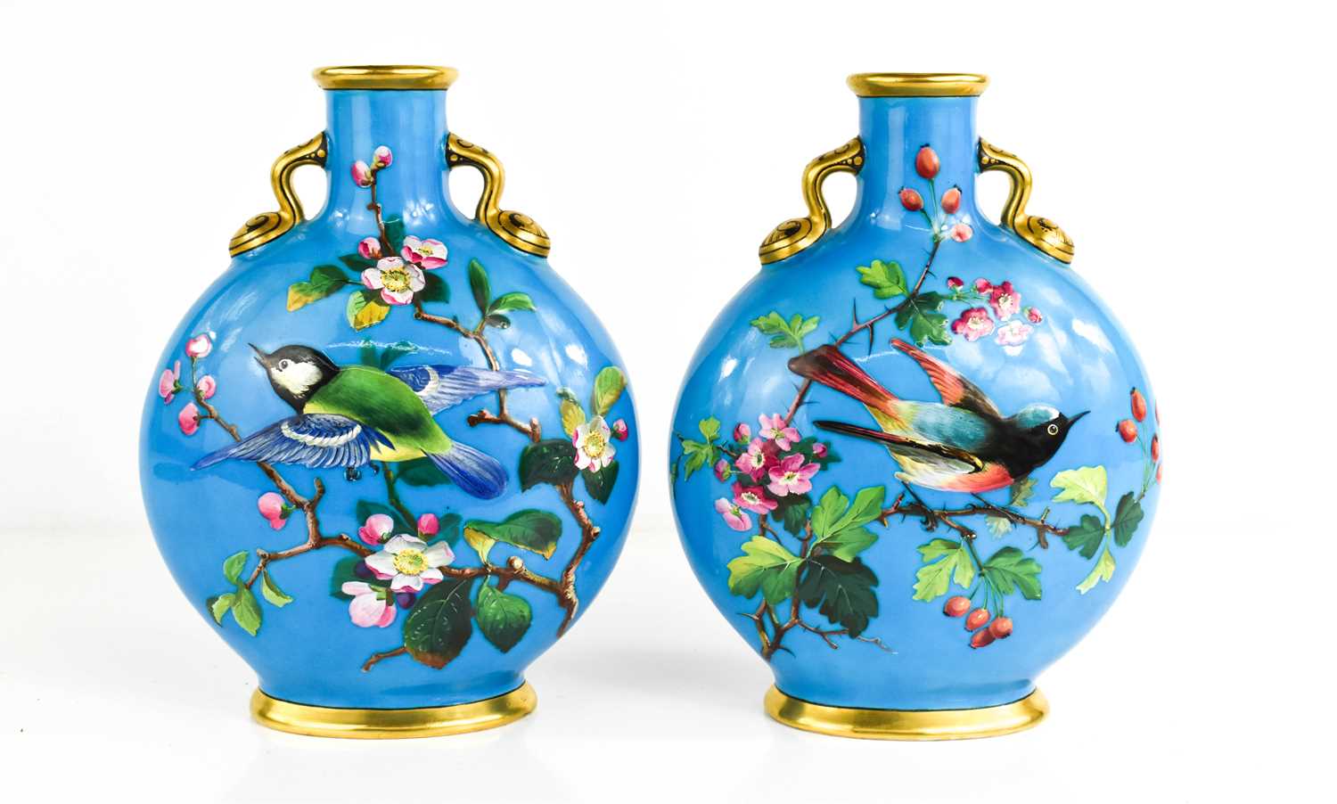 A pair of fine porcelain Minton moon flasks, with a blue celeste / turquoise ground, impressed