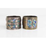 A pair of silver and enamel Art Nouveau Liberty style napkin rings, Sheffield 1922, 2.65toz.
