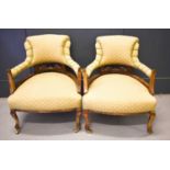 A pair of 19th century bow armchairs, with scroll arms, upholstered in gold coloured brocade to