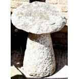 An antique granite saddle stone.