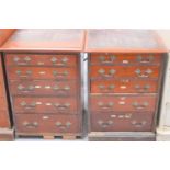 A pair of 19th century oak sets of drawers, six deep graduated drawers having decorative handles and