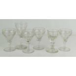 A set of four Victorian glasses etched with grape and vine design, together with a late Georgian