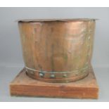 A large 19th century copper cauldron, riveted and stamped 10g to the rim, 50.5cm wide.