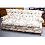 A Peter Guild two seater button back sofa with foliate upholstery