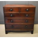 A Victorian mahogany chest of two short over three long drawers raised on bracket feet, 104cm high