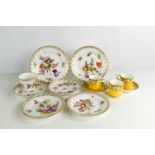 Two Royal Worcester coffee cans and saucers together with a group of Dresden porcelain plates