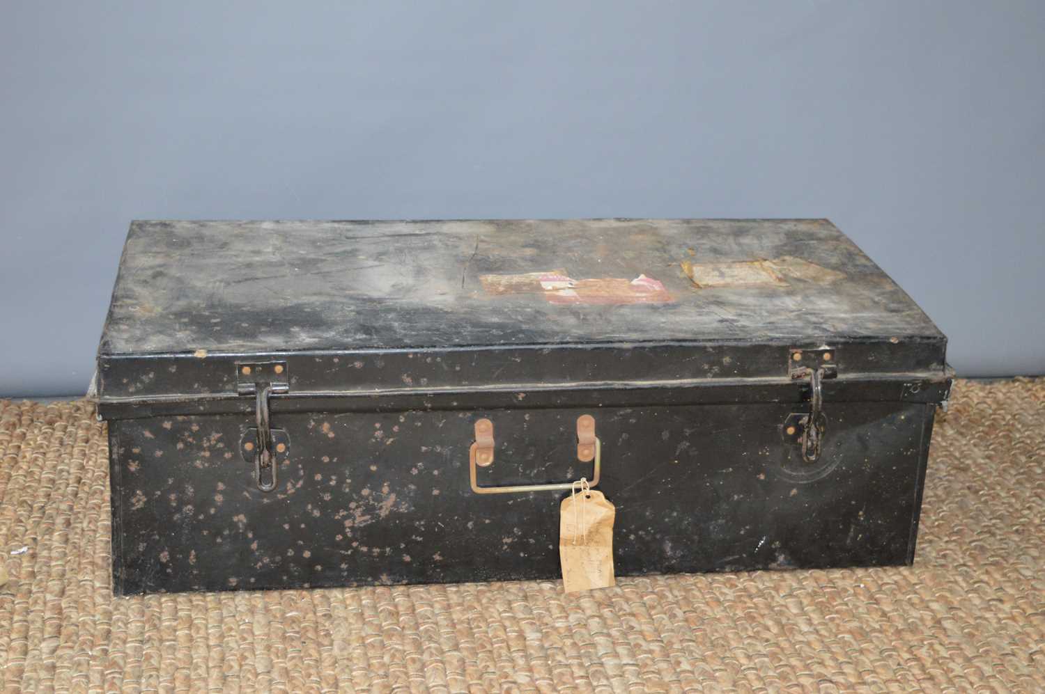 An early 20th century metal steamer trunk.