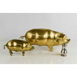 A Garrards silver salt shaker, London 1954, 1.77toz, together with two brass pig money boxes, the