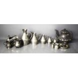A set of Irish pewter graduated measures, together with a teapot, salt, tankards and other items.