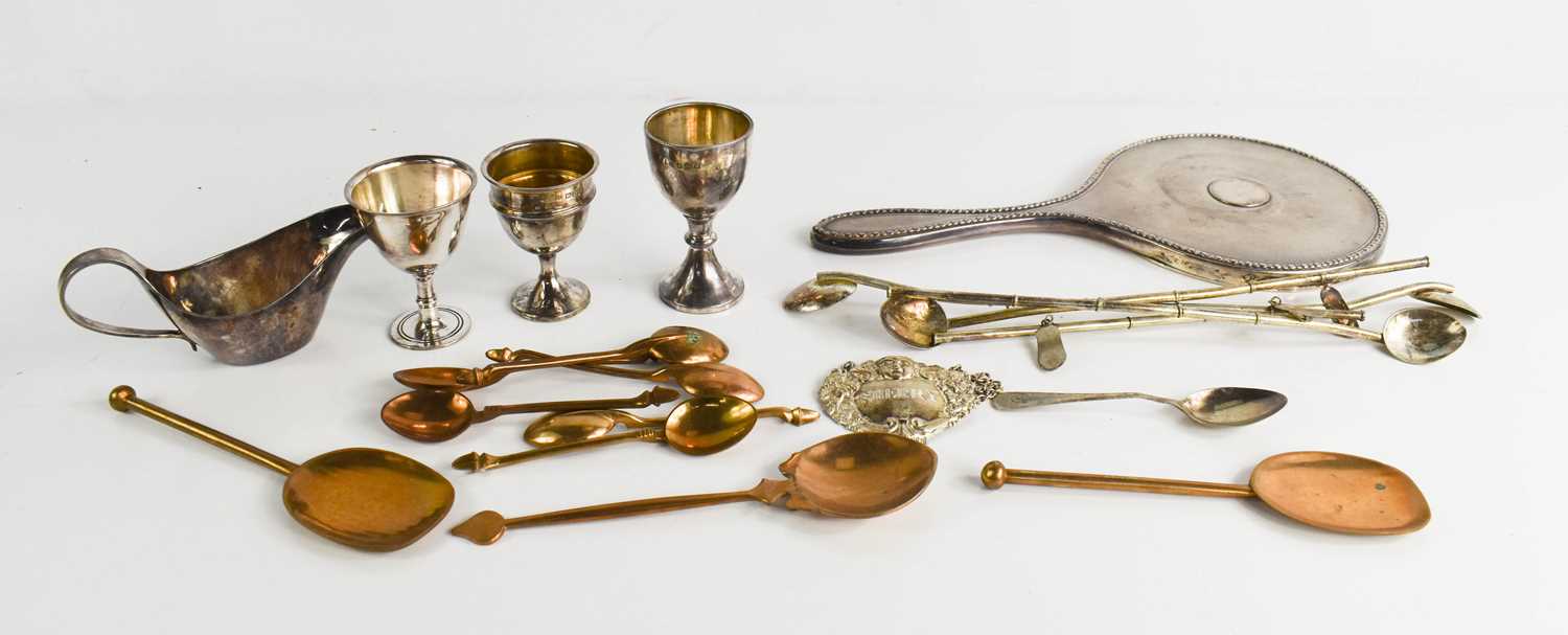 Five silver Chinese 'bamboo' form spoons, two silver egg cups, a silver Sherry bottle tag, silver