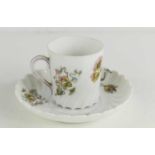 An early 20th century Ch. Lecerf of Paris coffee can and saucer decorated with floral scenes, Sevres