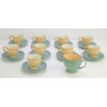 A Denby green coffee set comprising cups, saucers and cream jug.