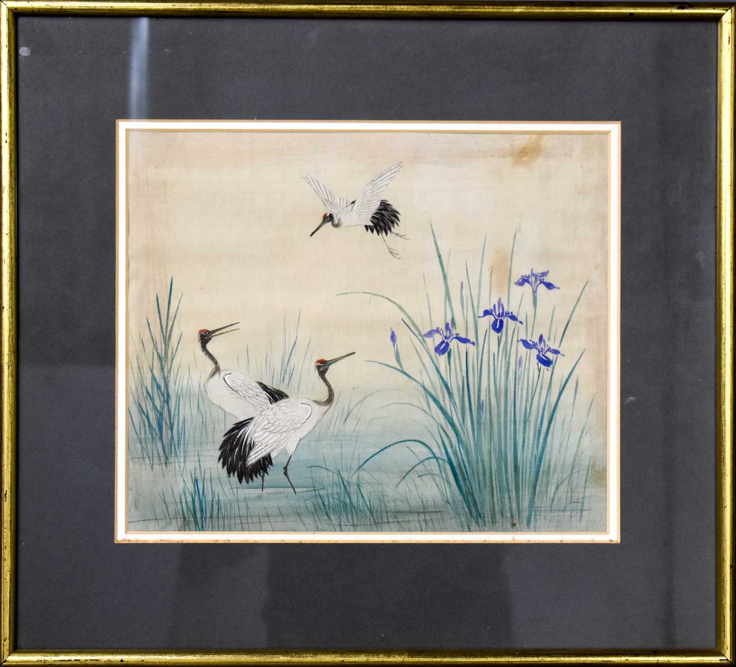 A Chinese gouache on silk, depicting cranes and irises, unsigned, circa 1900.