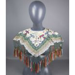 A Qing dynasty Chinese silk wedding collar, the ivory ground embroidered with a young woman and a