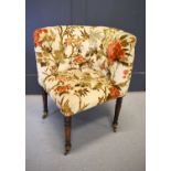 A late 19th Century corner chair, button back foliate upholstery, on tapered ring turned legs and