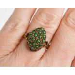 A vintage 9ct gold ring, the large marquise shaped setting with eighteen jade cabouchons, size O,