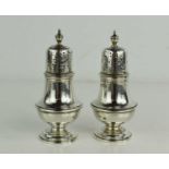 A pair of George III silver salt and pepper pots, London 1911, by CS Harris of London, 10cm high,