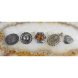 A group of Victorian and later silver brooches and pendants, including a filagree oval locket and