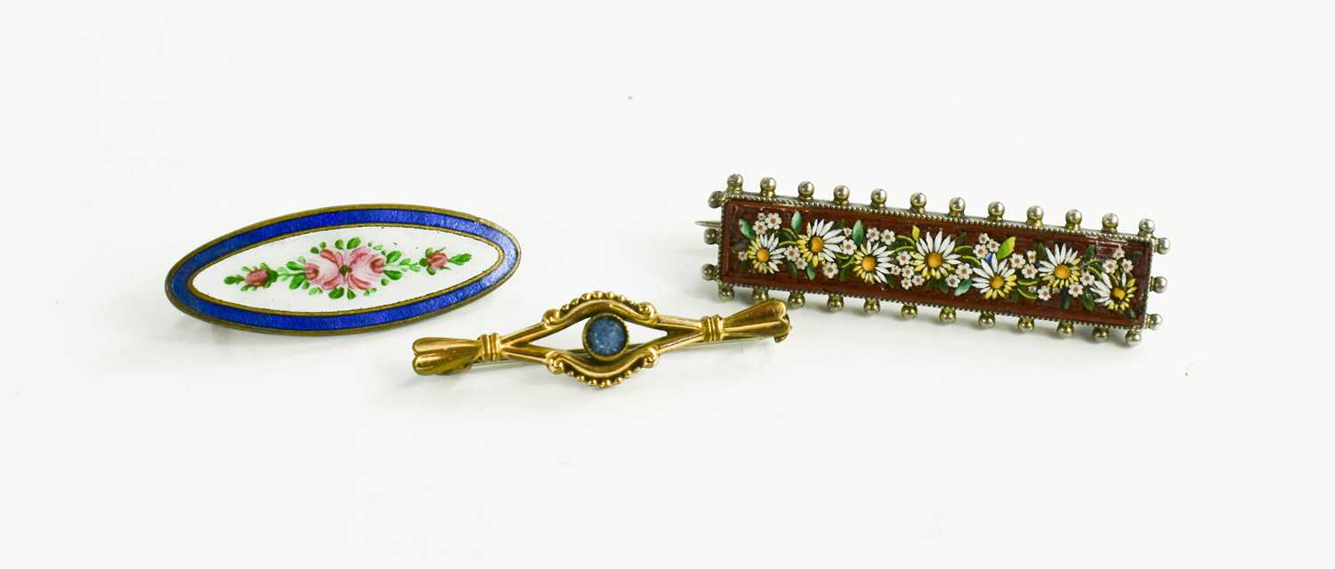 A group of three vintage brooches, comprising a micromosaic rectangular example with beaded edge, an